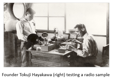 Founder Tokuji Hayakawa (right) testing a radio sample
